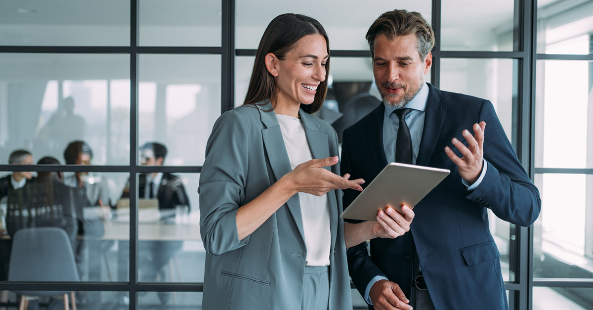 Two business people looking at a tablet